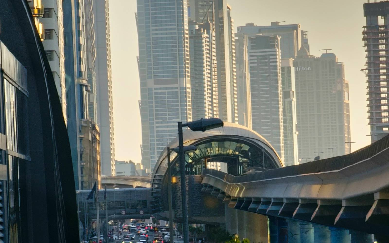 A Dubai metro station above a busy road